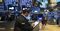 الأسهم الأميركية تقفز مع بدء نقل السلطة إلى بايدن